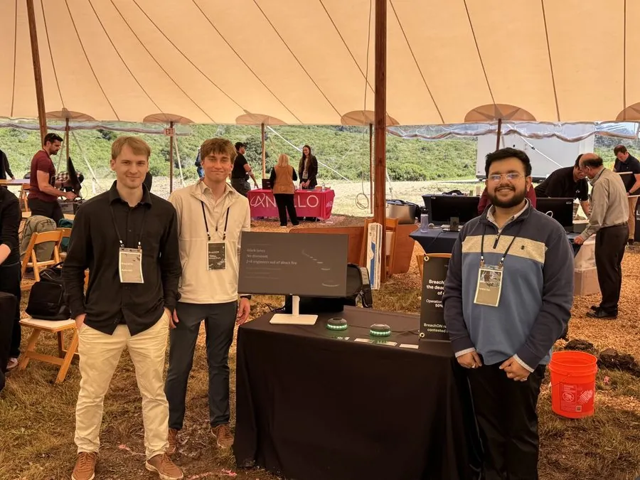 BreachON team at Red Queen 7 event inside a field tent